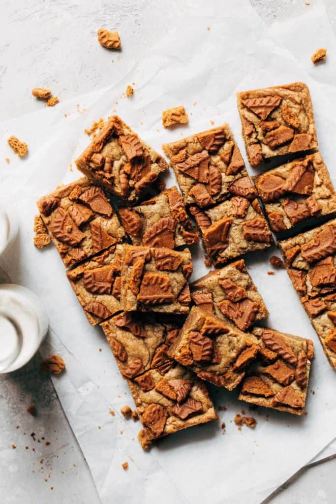 sliced blondies scattered on parchment paper