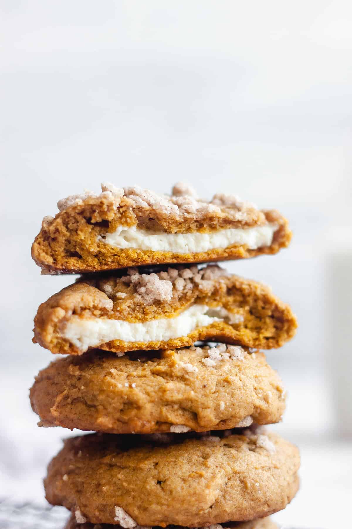 Pumpkin cheesecake cookies stacked on top of each other