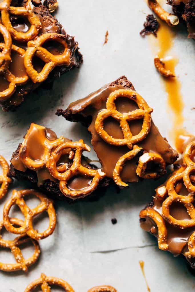 brownie topped with caramel and pretzels