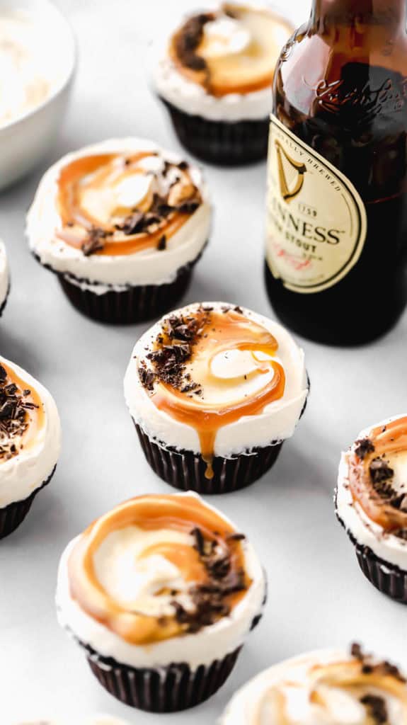 guinness chocolate cupcakes with salted caramel dripping off the frosting