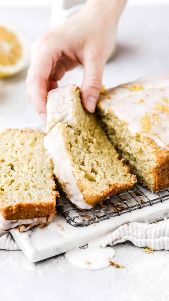 a slice of lemon zucchini bread being picked up