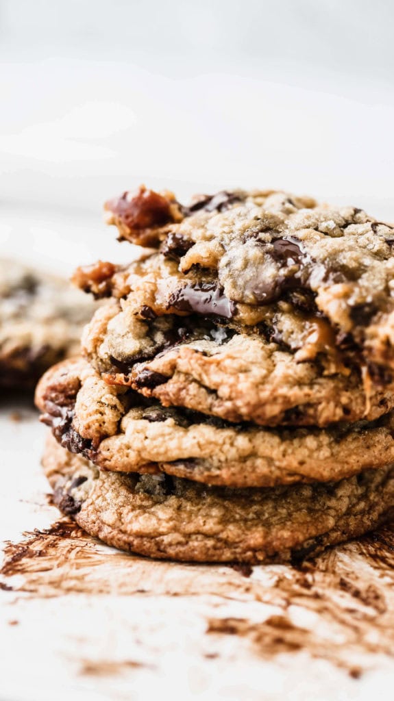 a stack of melty salted caramel chocolate chip cookies