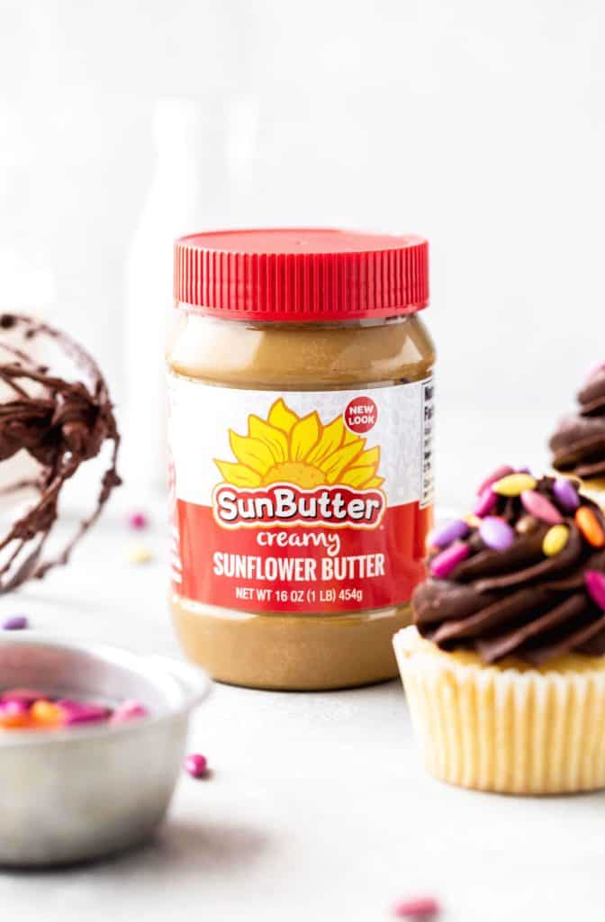 a jar of sunbutter used to make fudgy chocolate frosting