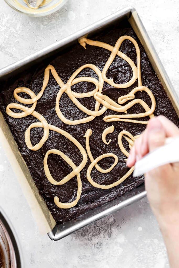 tahini and peanut butter swirled into brownie batter