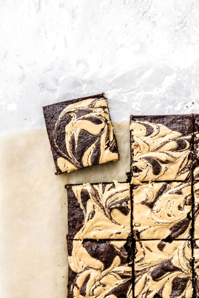 a tahini and peanut butter swirl brownie cut out from the pan