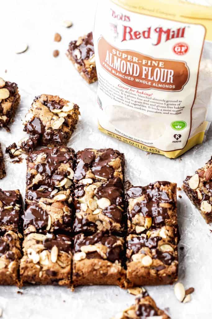 a tray of sliced almond chocolate chip cookie bars