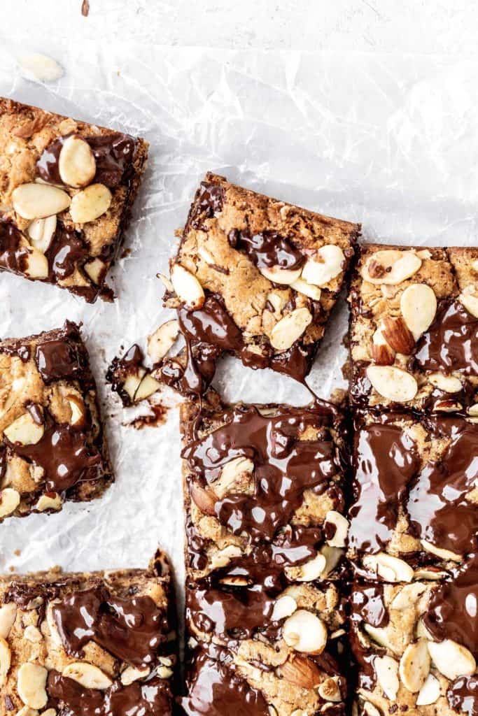 almond chocolate chip cookie bars being pulled away from the rest