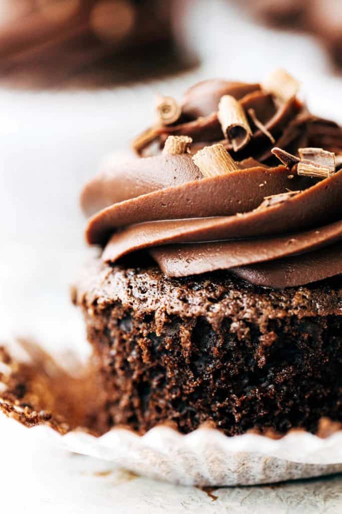 close up on a chocolate cupcake with chocolate curls on top
