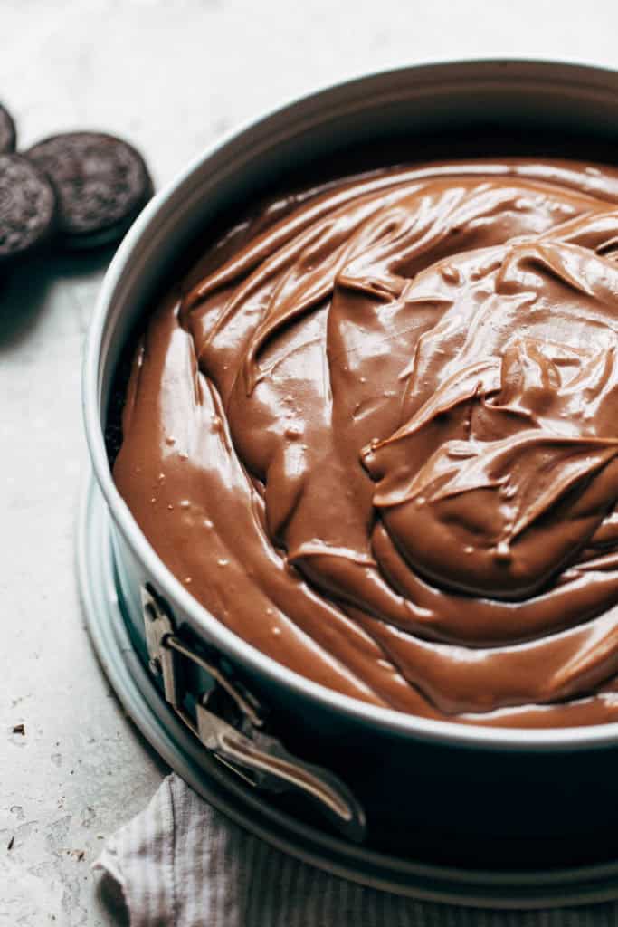chocolate cheesecake batter in a springform pan