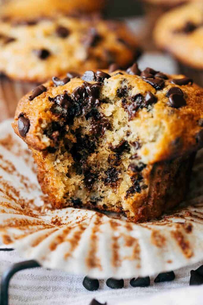 close up of a banana chocolate chip muffin with a bite taken out