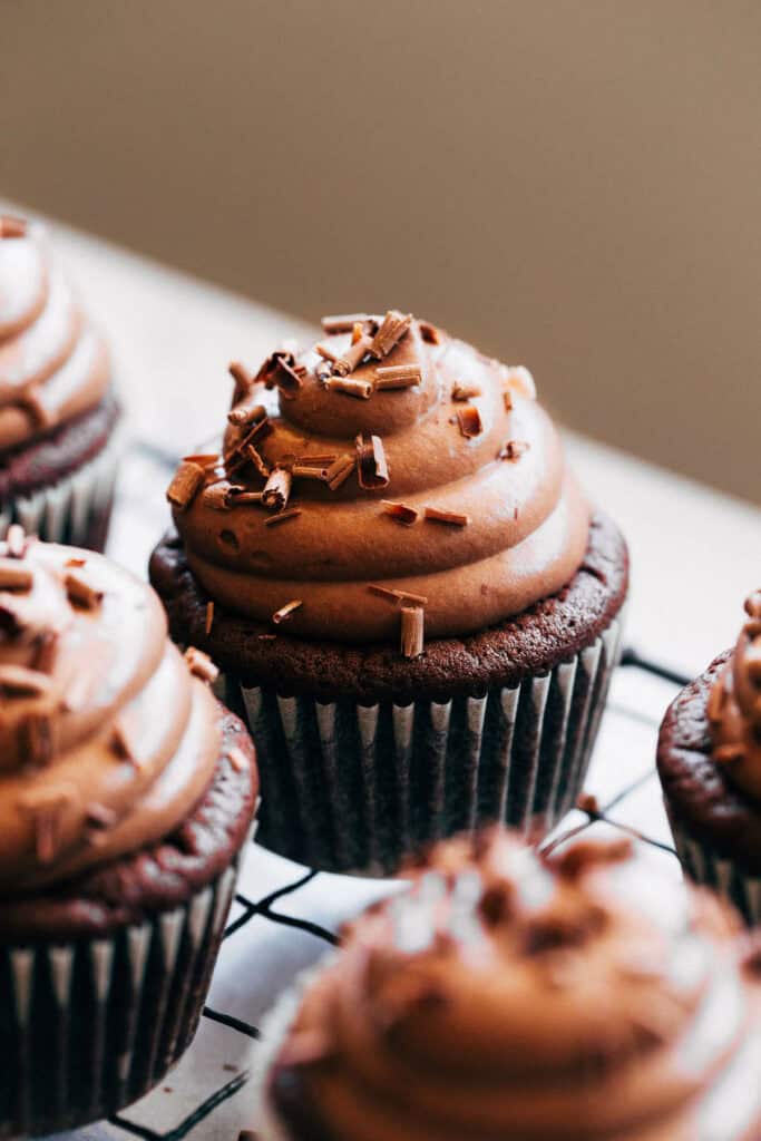 close up of a chocolate mousse cupcake with shaved chocolate topping