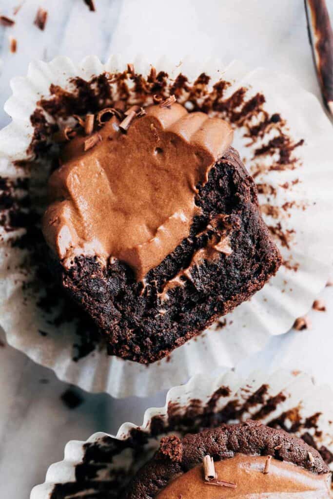 close up of a chocolate mousse cupcake with a bite taken out