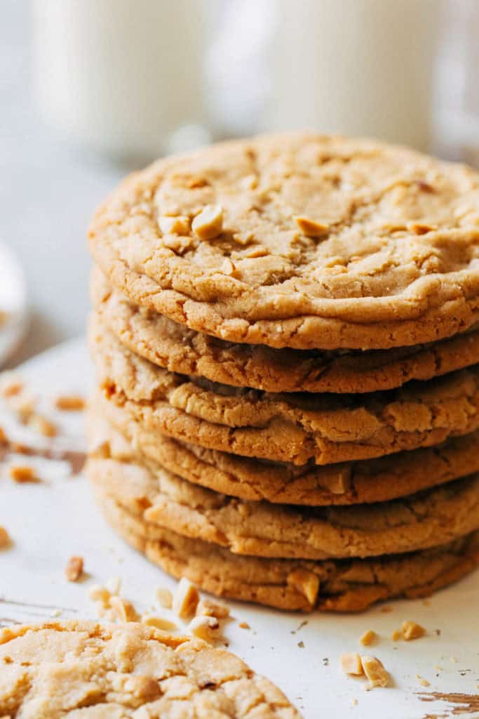 a stack of thin and chewy peanut butter cookies