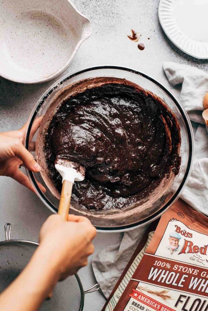 folding brownie batter with a rubber spatula