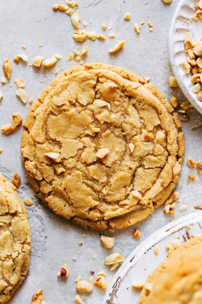 the top of a chewy peanut butter cookie sprinkled with chopped peanuts