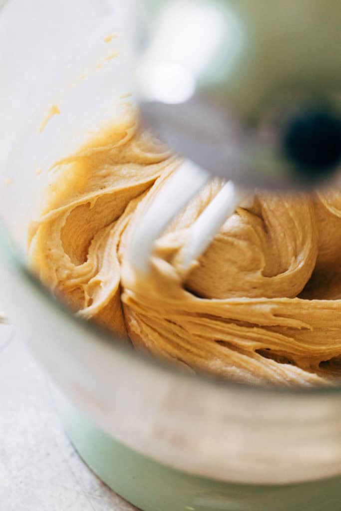 peanut butter cookie dough wet ingredients mixing in a stand mixer