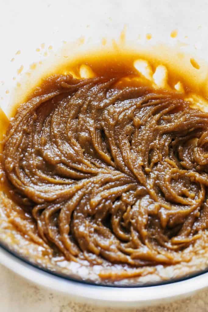 butter and sugar creamed together in a mixing bowl