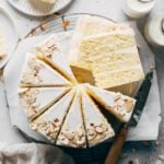 the top view of a sliced almond layer cake