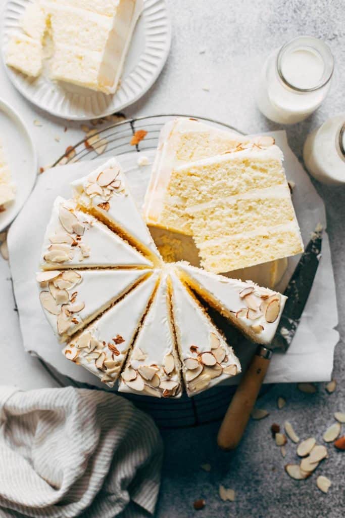 the top view of a sliced almond layer cake