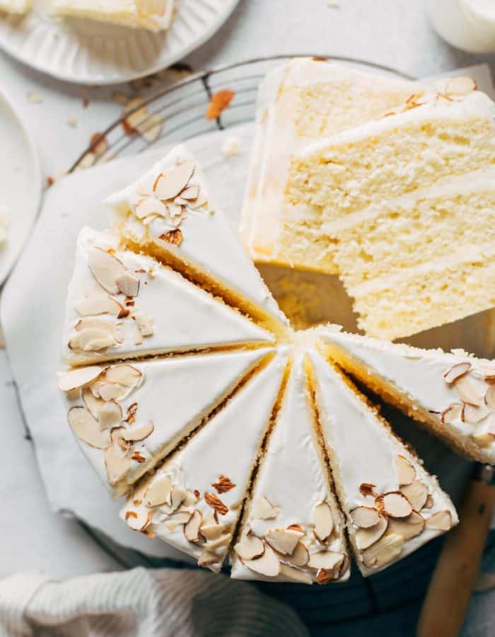 close up on the top view of a sliced almond cake
