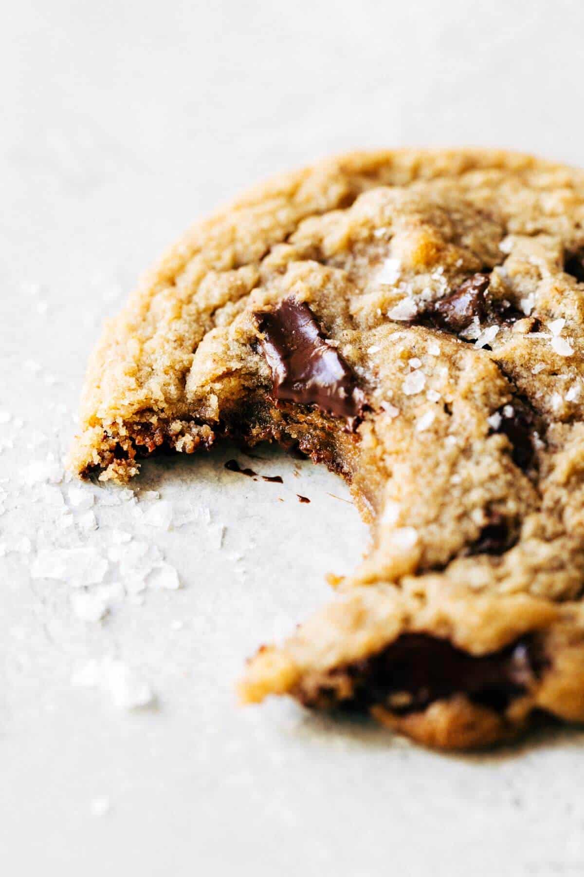 a brown butter chocolate chip cookie with a bite taken out
