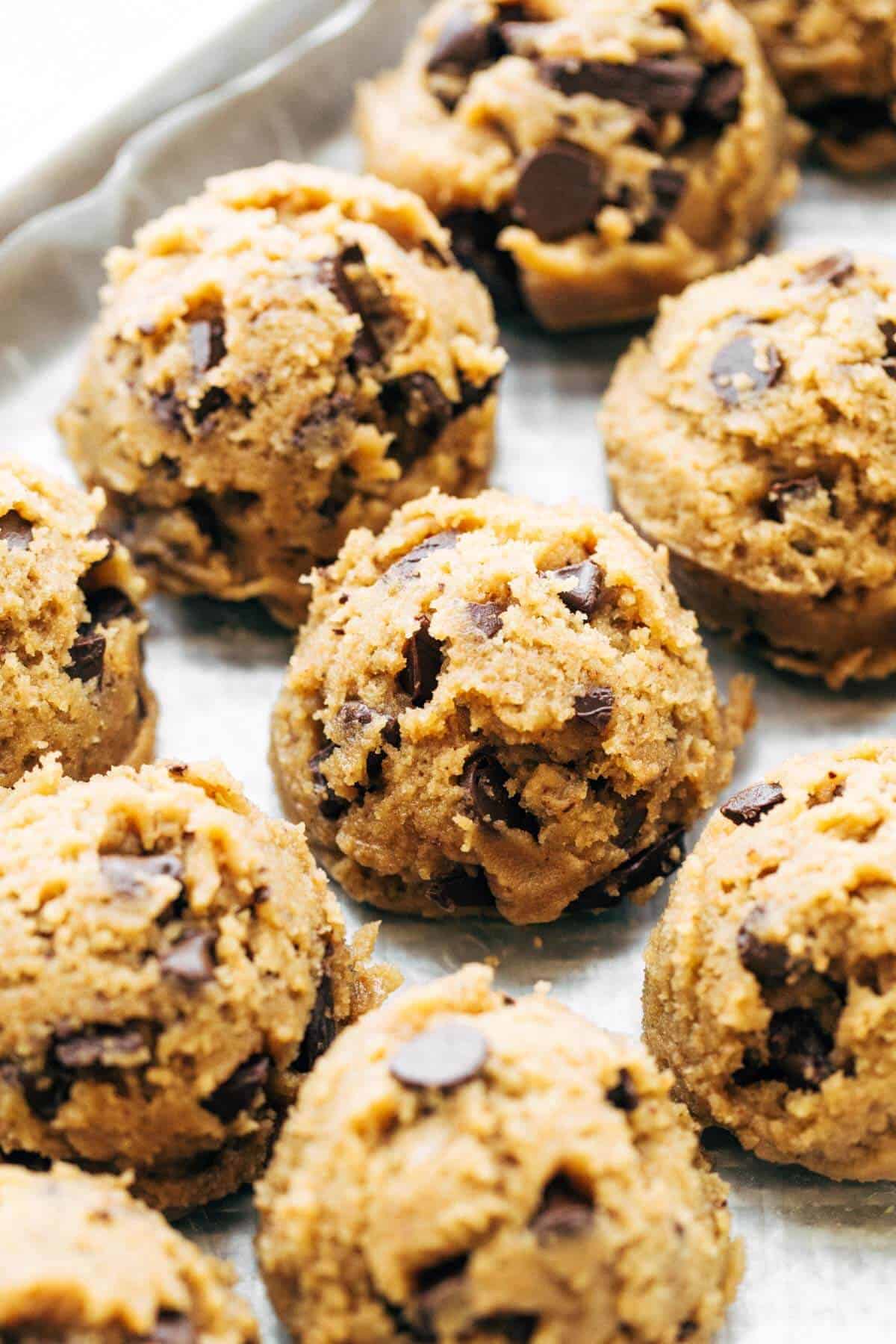 a tray of scooped brown butter chocolate chip cookie dough