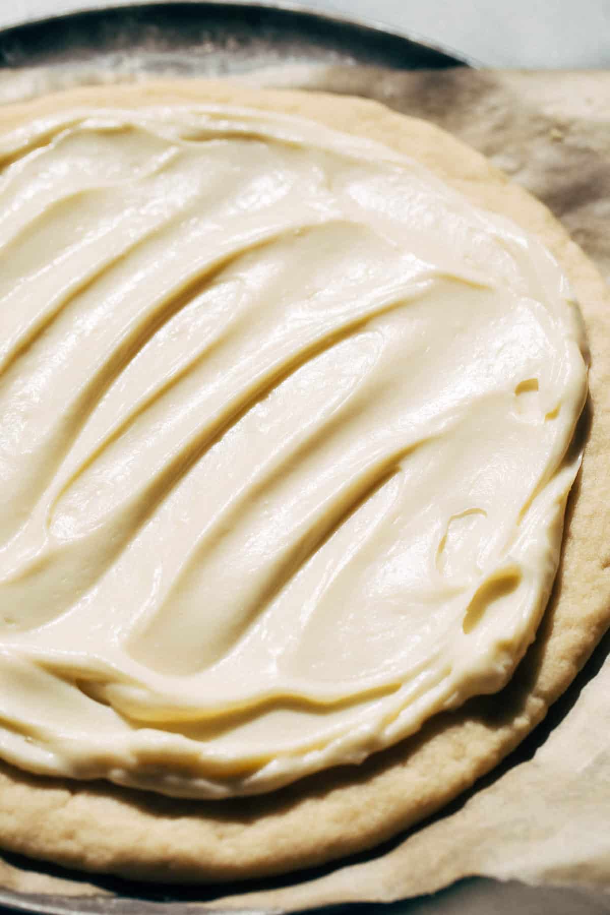 cream cheese spread on top of a shortbread crust