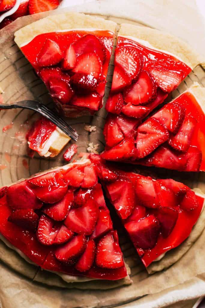 the top of a fully sliced strawberry pizza