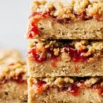 stacked peanut butter and jelly cheesecake bars