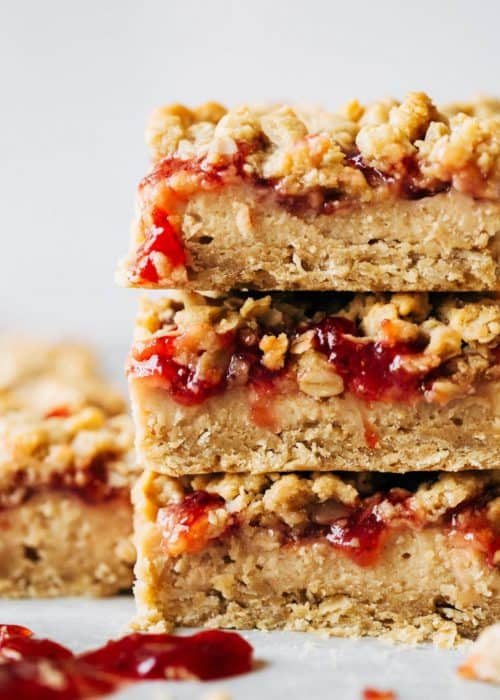 stacked peanut butter and jelly cheesecake bars