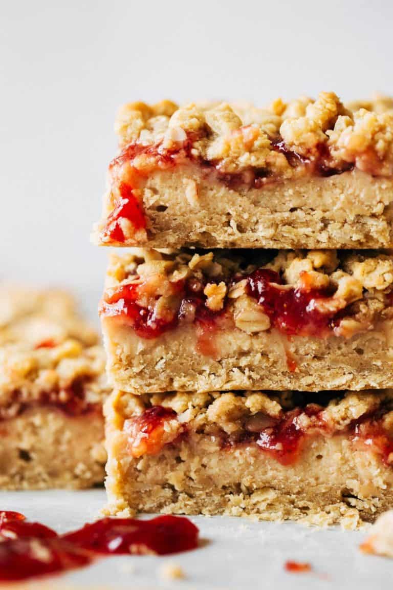 stacked peanut butter and jelly cheesecake bars