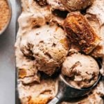 scoops of churro ice cream in a loaf pan