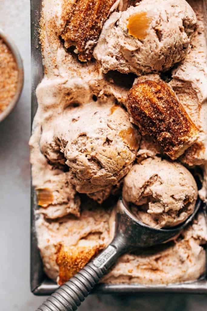 scoops of churro ice cream in a loaf pan