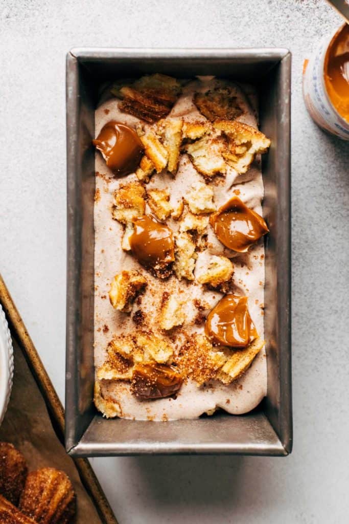 layering churro ice cream in a loaf pan