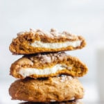 Pumpkin cheesecake cookies stacked on top of each other