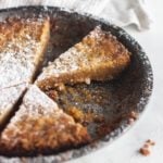 sliced crack pie with powdered sugar on top