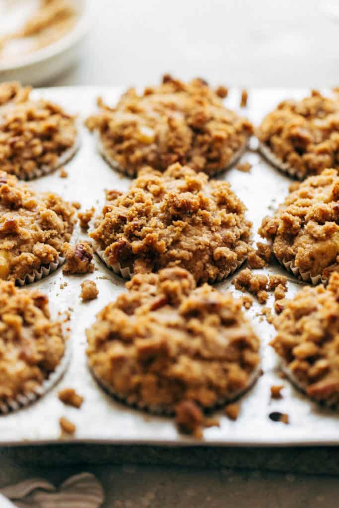close up on the tops of freshly baked apple crumble muffins
