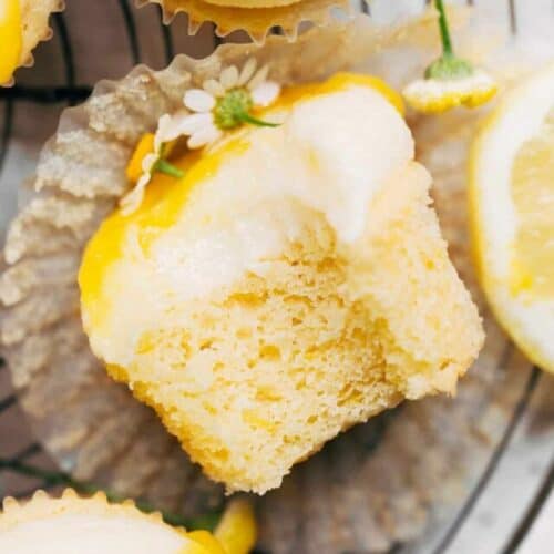 a bite taken from a lemon cupcake
