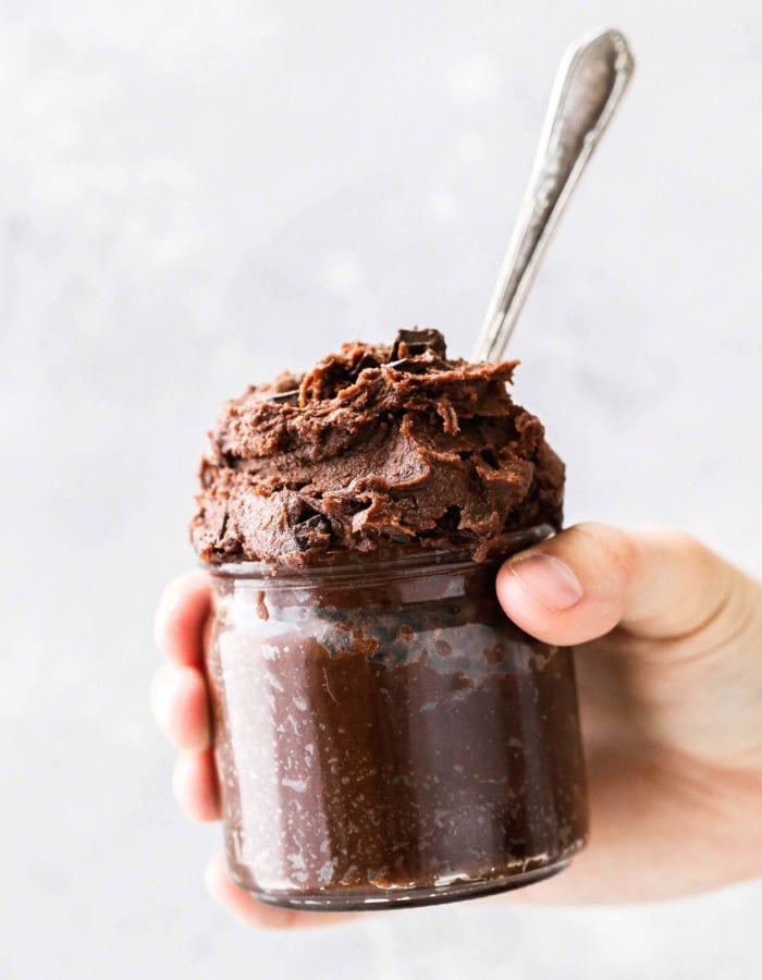 holding a jar of edible brownie batter cookie dough