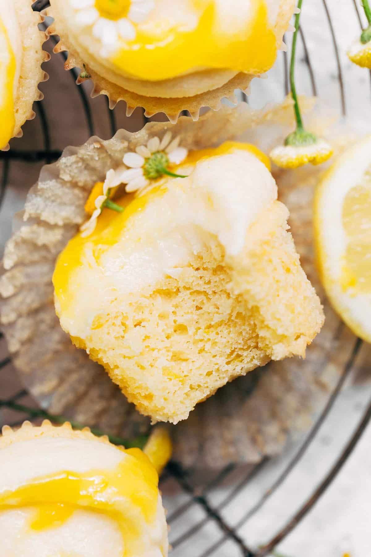 a bite taken from a lemon cupcake