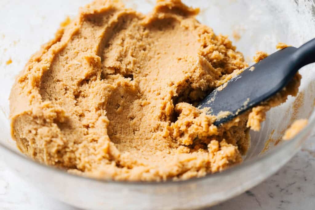 a bowl of pumpkin cookie dough