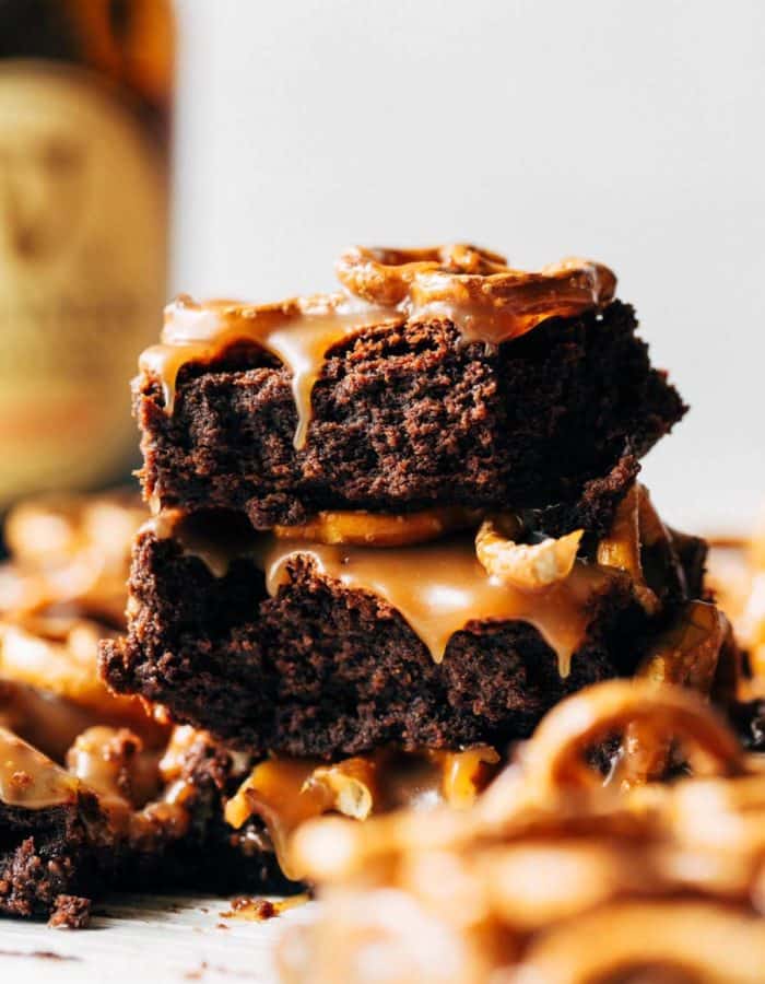 a stack of Guinness brownies with caramel dripping down the sides