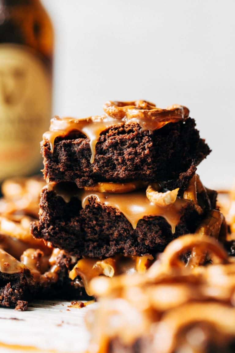 a stack of Guinness brownies with caramel dripping down the sides