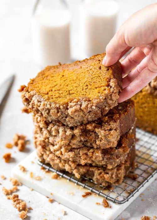 a stack of pumpkin bread slices with streusel topping