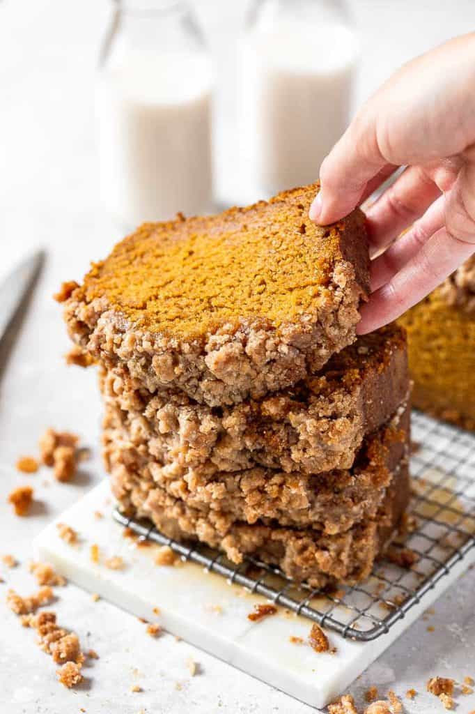 a stack of pumpkin bread slices with streusel topping