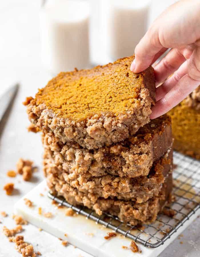 a stack of pumpkin bread slices with streusel topping