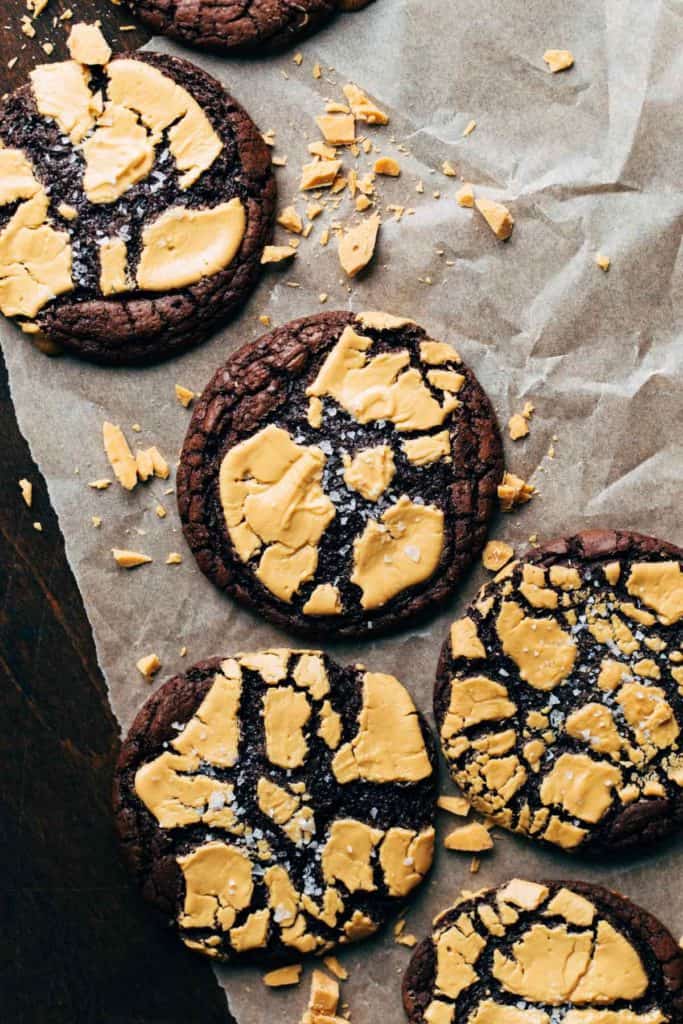 the tops of brownie cookies baked with cracked caramelized white chocolate on top