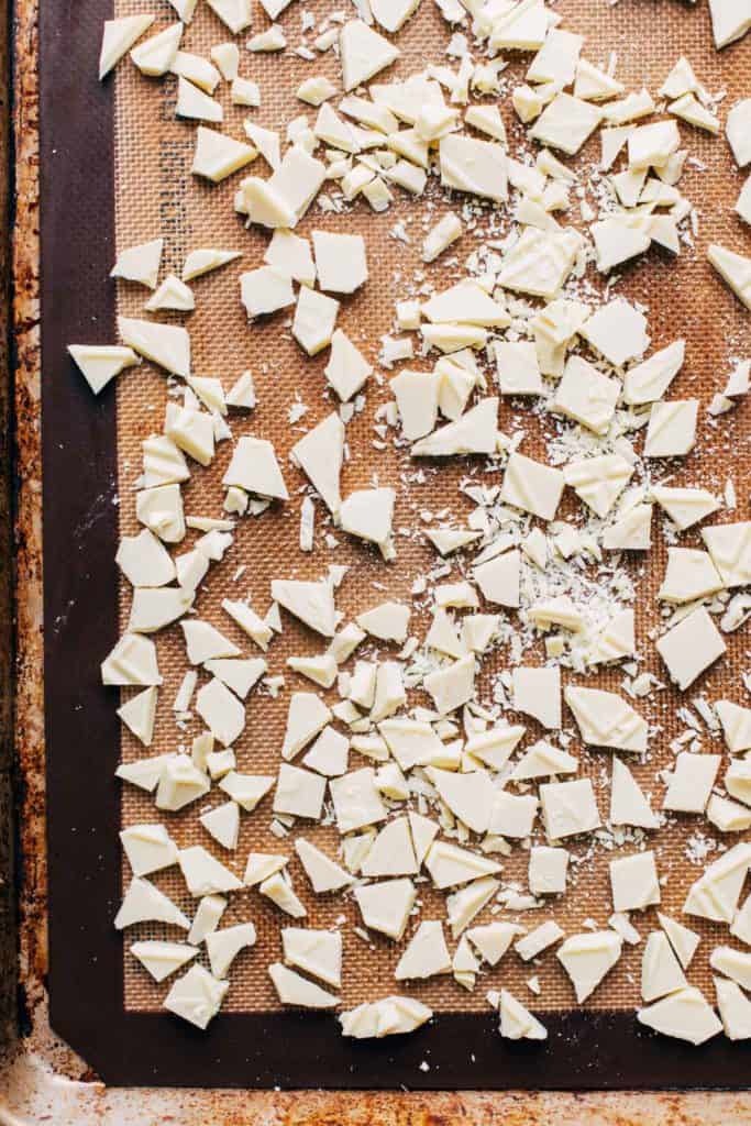 chopped white chocolate on a baking sheet