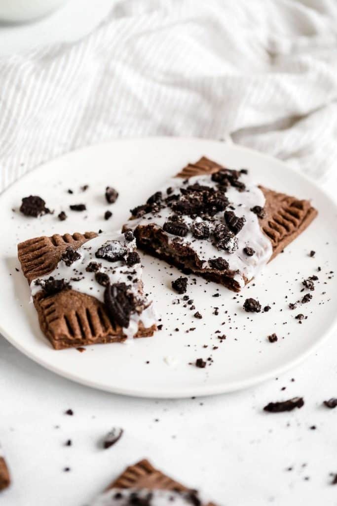 a pop tart broken in half on a plate