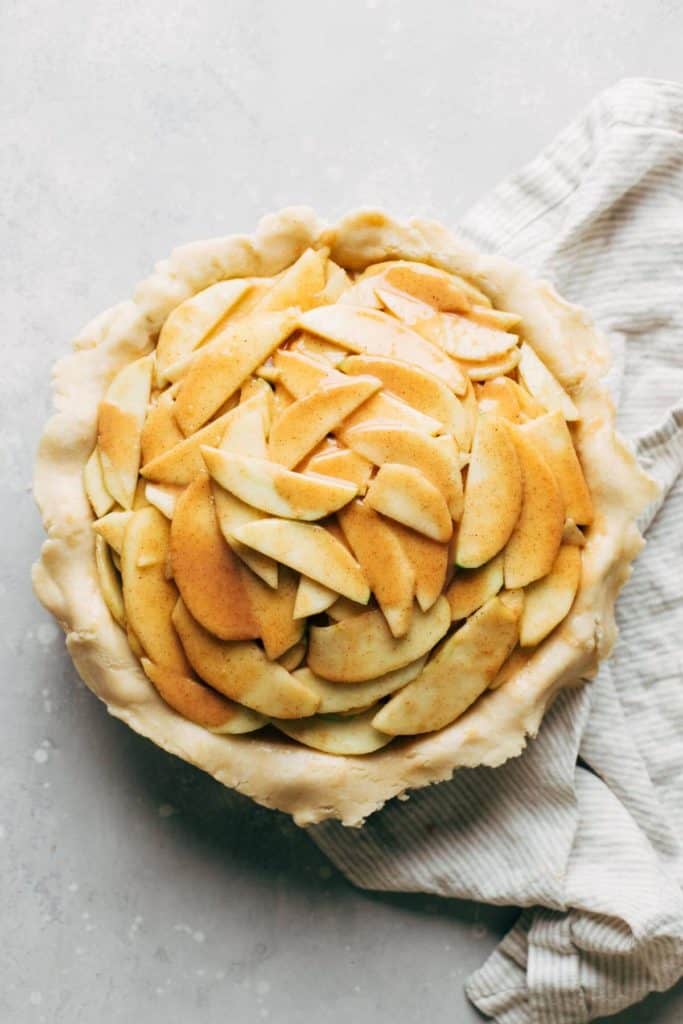 apple pie filling inside a homemade pie shell